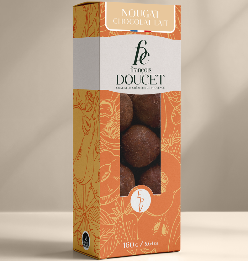 Nogado coberto com chocolate de leite e cacau em pó Maison Molinet